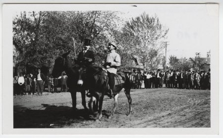 Men riding horses on Main Street, Russellville, Ark.