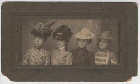 Four ladies wearing hats